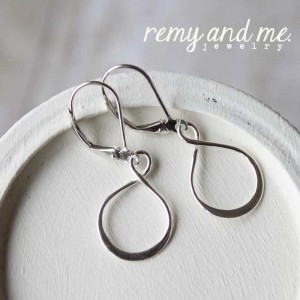 Sterling silver infinity dangle earrings on leverback earwire.